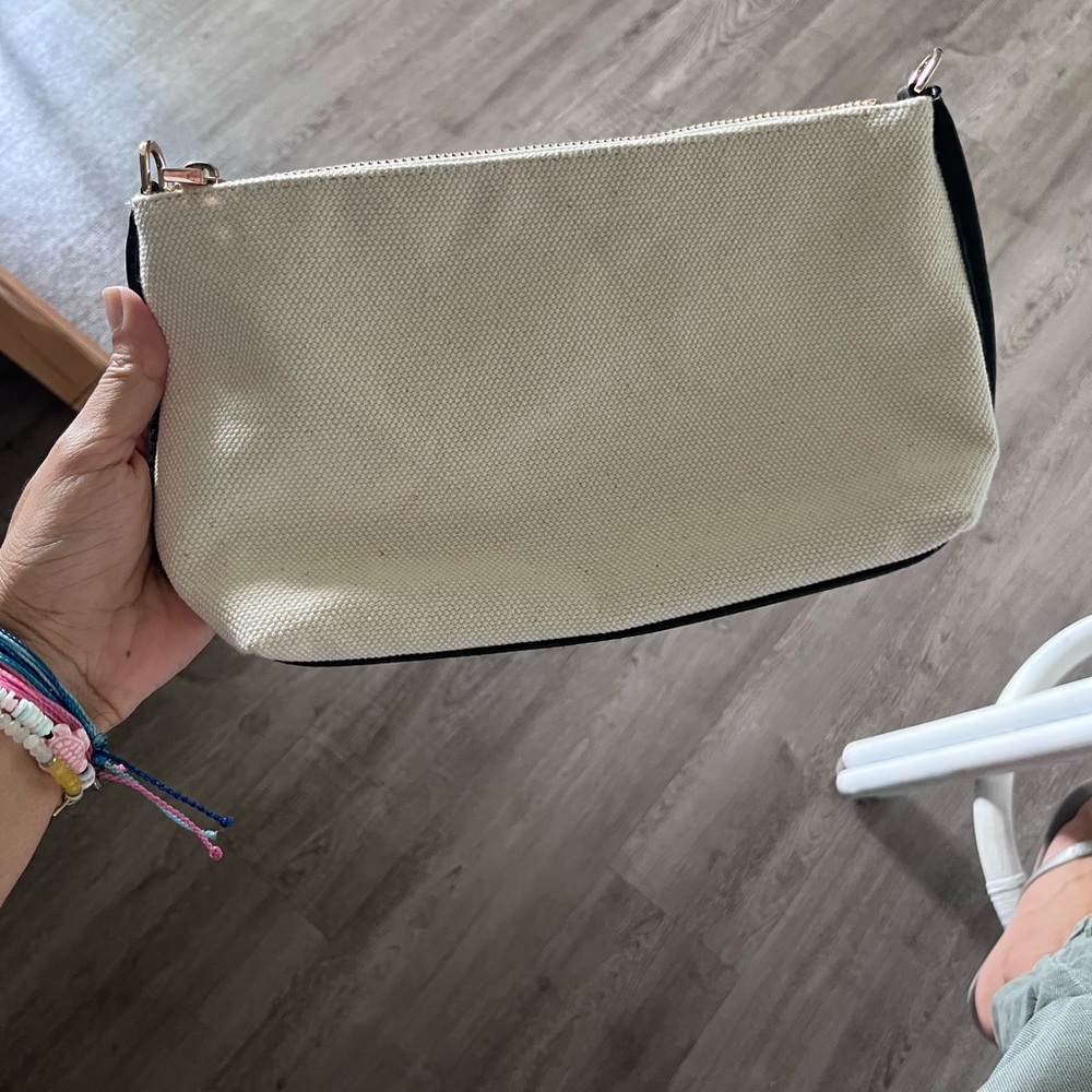 A New Day Cream and Black Cosmetic Bag with Minimalist Design